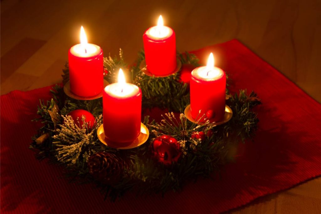 Green advent wreath with four red candles