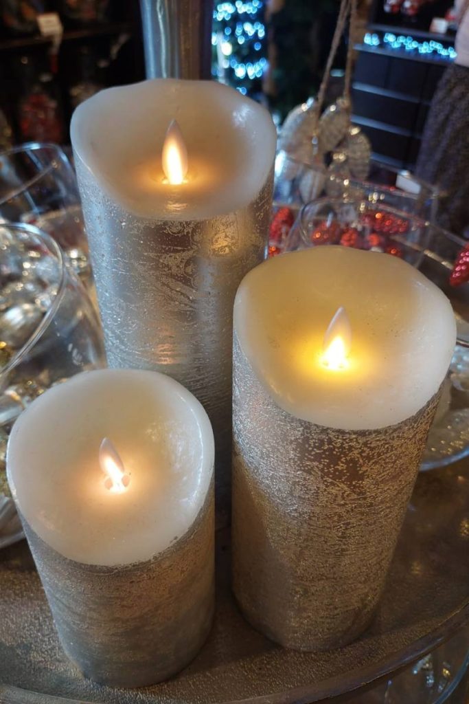 three white led taper candles