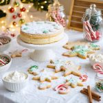 Overhead 45-degree view of a Christmas cookie-decorating station with cake stands of iced cookies, bowls of frosting and piping bags, mason jars of colorful sprinkles, and candy canes on a white table, with warm string lights and evergreen accents; blurred cookie display wall and ornament-filled jars in the background.